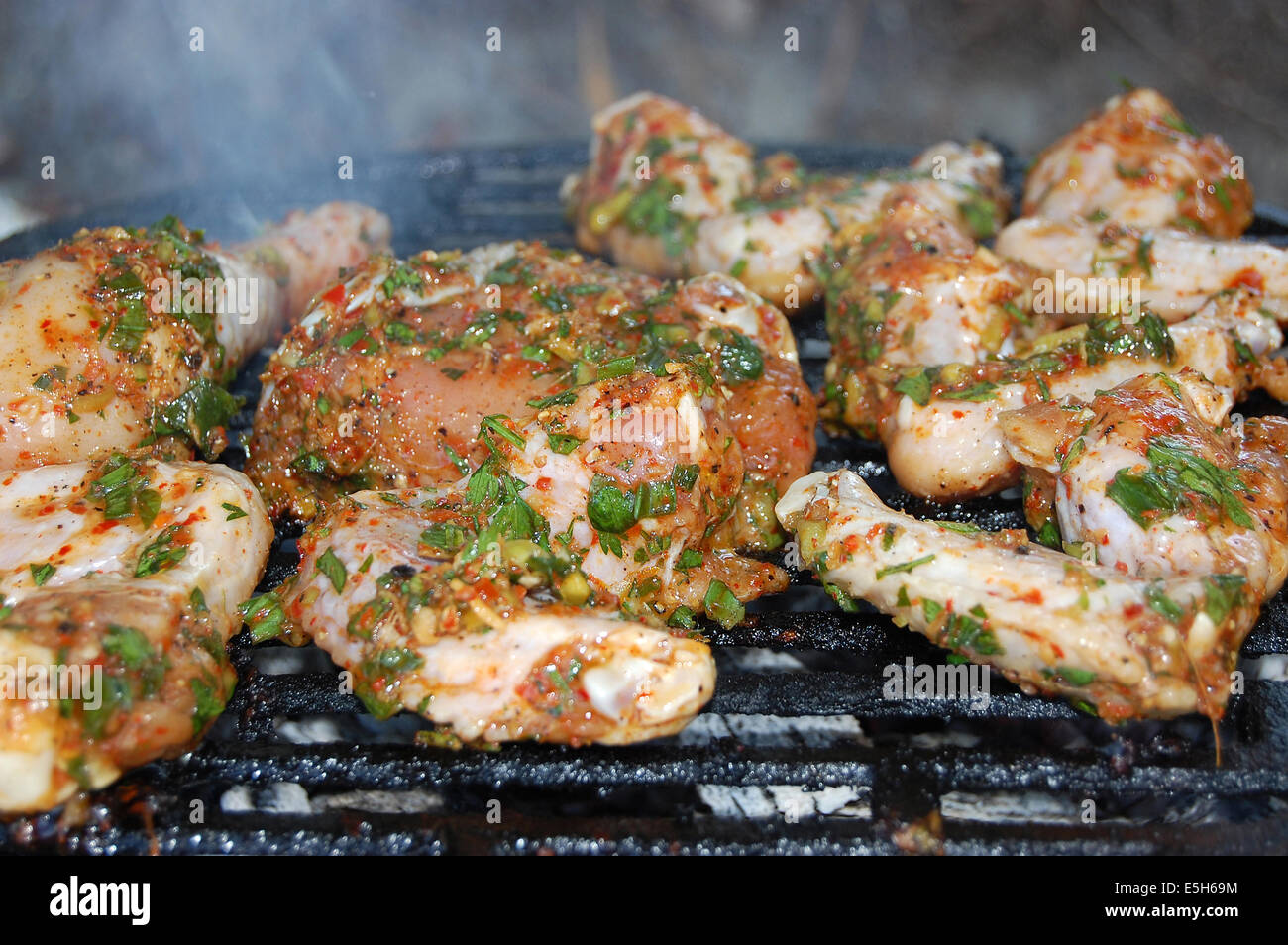 Hot chicken wings and drumsticks on the grill Stock Photo Alamy