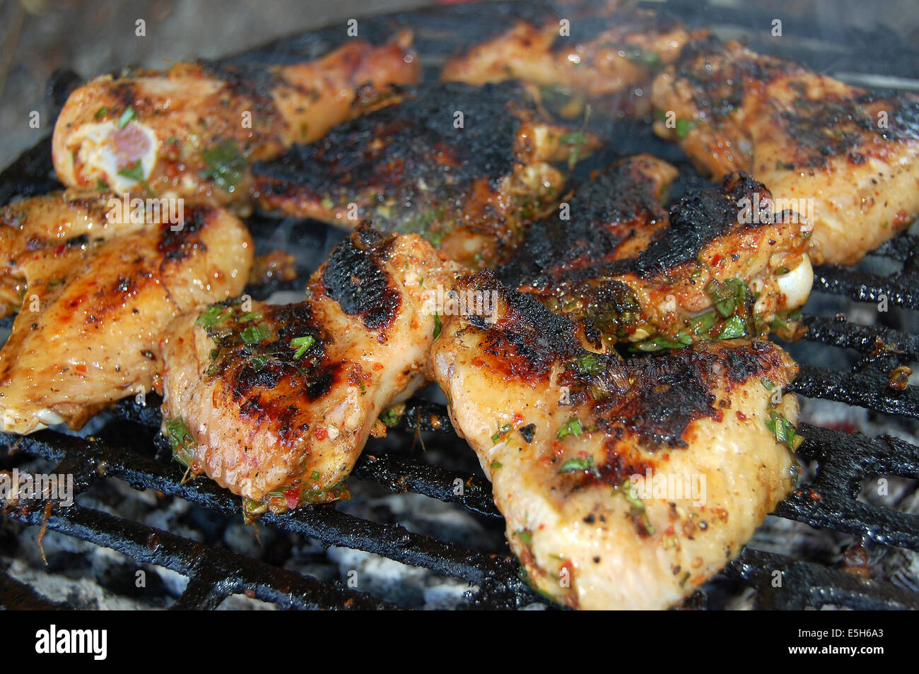 Hot chicken wings and drumsticks on the grill Stock Photo Alamy