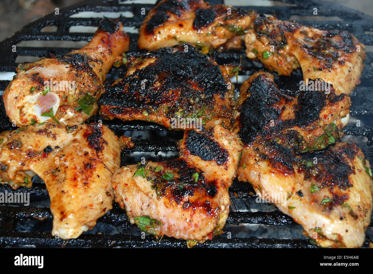 Hot chicken wings and drumsticks on the grill Stock Photo Alamy