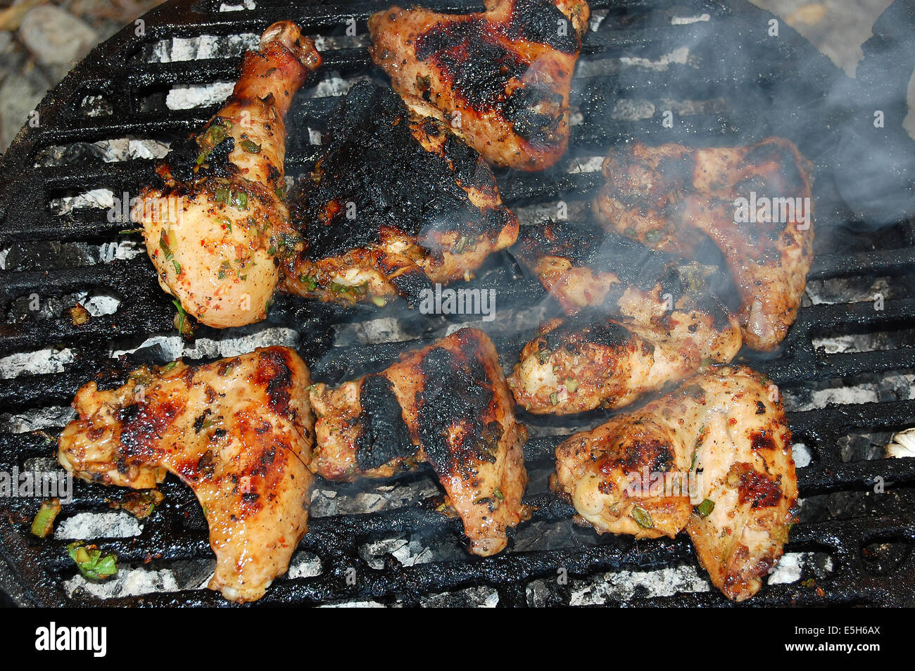 Hot chicken wings and drumsticks on the grill Stock Photo Alamy
