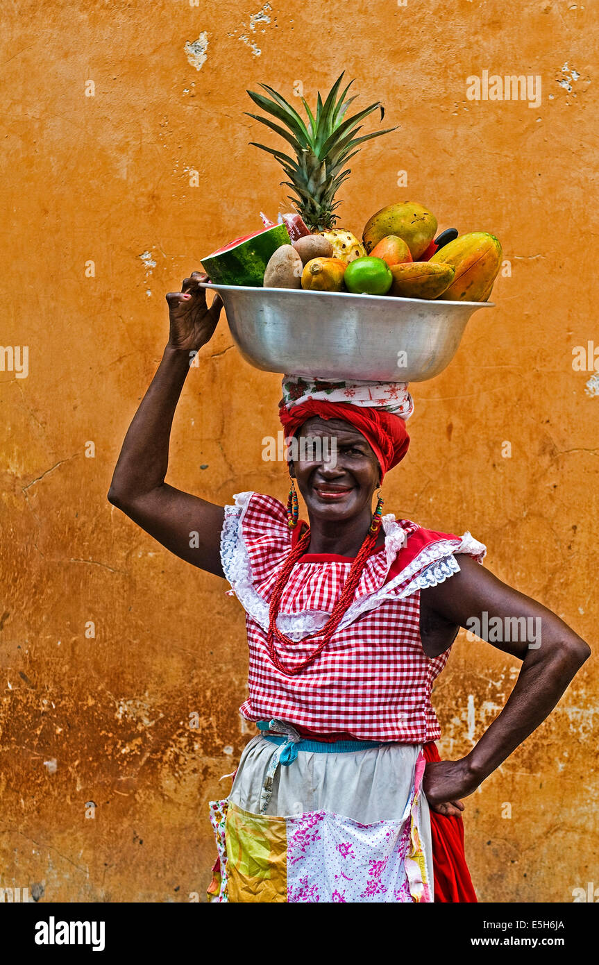 Palenquera woman sells fruts in Cartagena , Colombia.  Palenqueras are  a unique African descendat ethnic group found in the nor Stock Photo