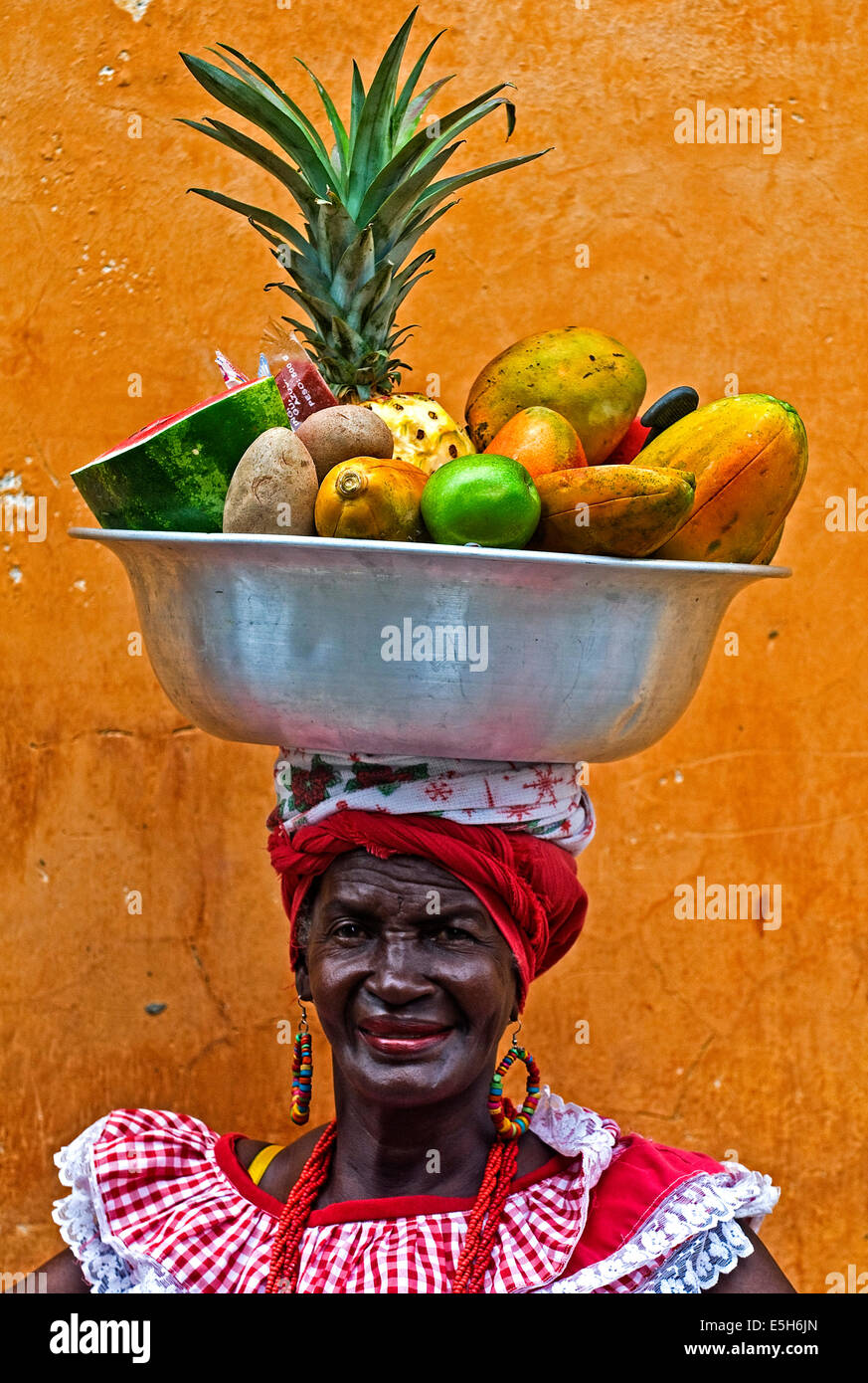 Palenquera woman sells fruts in Cartagena , Colombia.  Palenqueras are  a unique African descendat ethnic group found in the nor Stock Photo