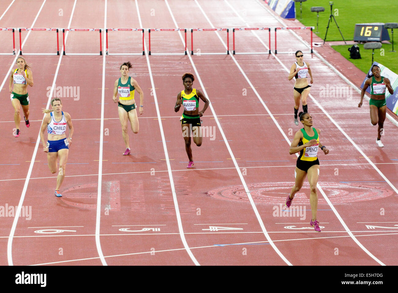 Hampden Park, Glasgow, Scotland, UK, Thursday, 31st July, 2014. Eilidh Child, Scotland, finishes third behind Kaliese Spencer, Jamaica, winner, with Janieve Russell, Jamaica, third in the Women's 400m Hurdles Final at the Glasgow 2014 Commonwealth Games Stock Photo