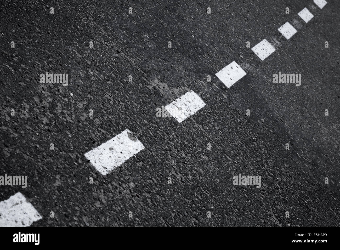 Dark asphalt road background with striped dividing marking line Stock Photo