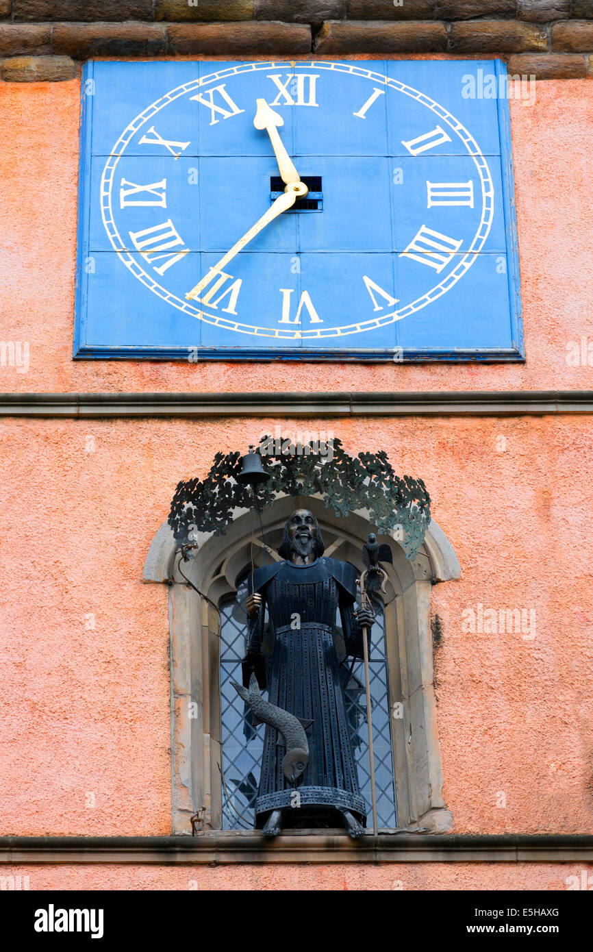 Statue of Saint Mungo, the patron saint of Glasgow, with the symbols of
