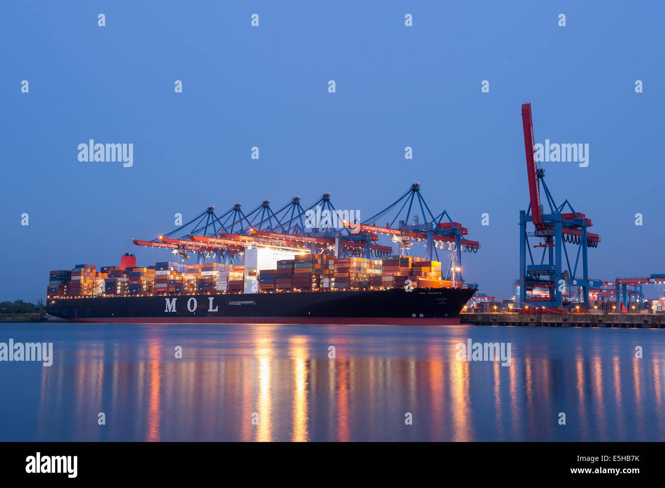 A Container ship is docked at the Port of Hamburg, 10 July 2014 in Hamburg. Stock Photo