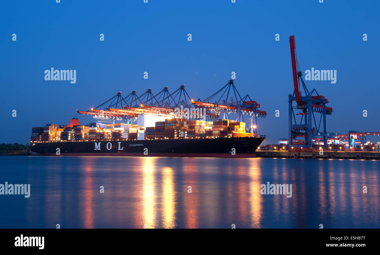 A Container ship is docked at the Port of Hamburg, 10 July 2014 in Hamburg. Stock Photo
