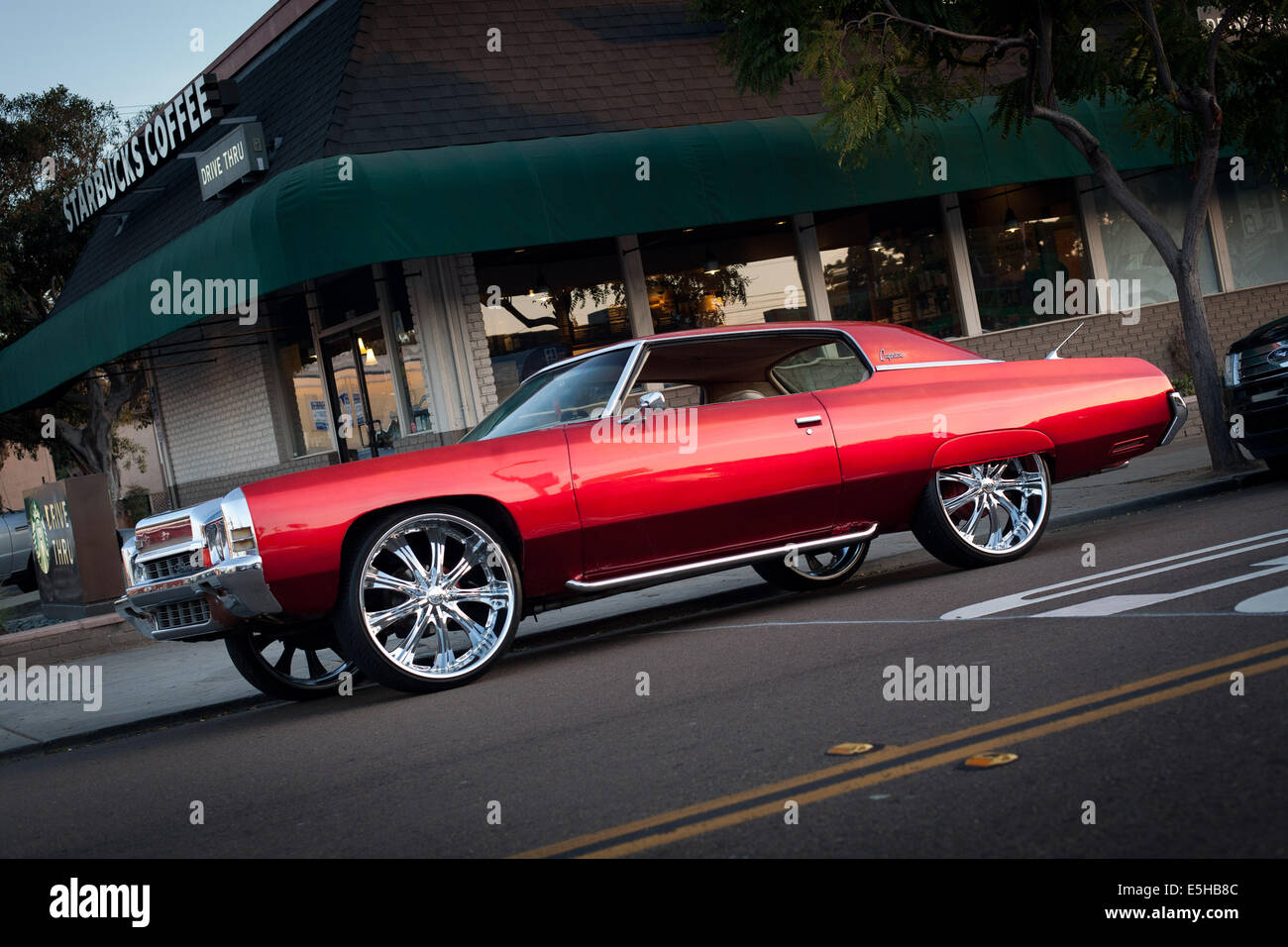Chevrolet Caprice with chrome-plated star rims, parked in front of a  Starbucks in Pacific Beach, in April 2014 Stock Photo - Alamy