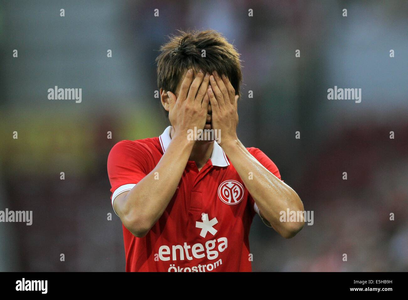 Mainz's Ja-Cheol Koo reacts during the UEFA Europa League qualification match between FSV Mainz 05 and  Asteras Tripolis FC at Corface Arena in Mainz, Germany, 31 July 2014. Photo: FREDRIK VON ERICHSEN/dpa Stock Photo