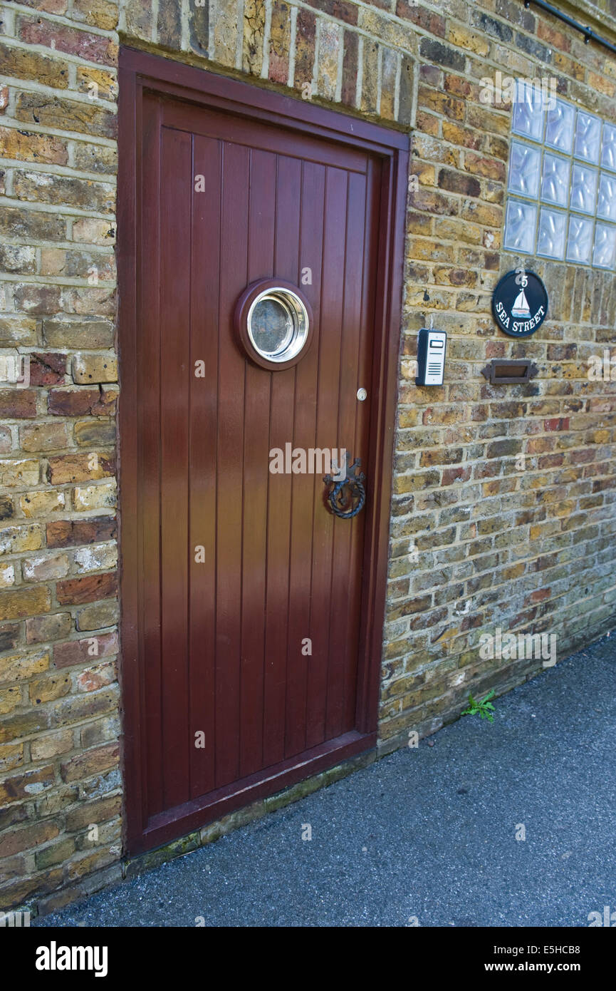 Wooden brown front door with of renovated house in Whitstable