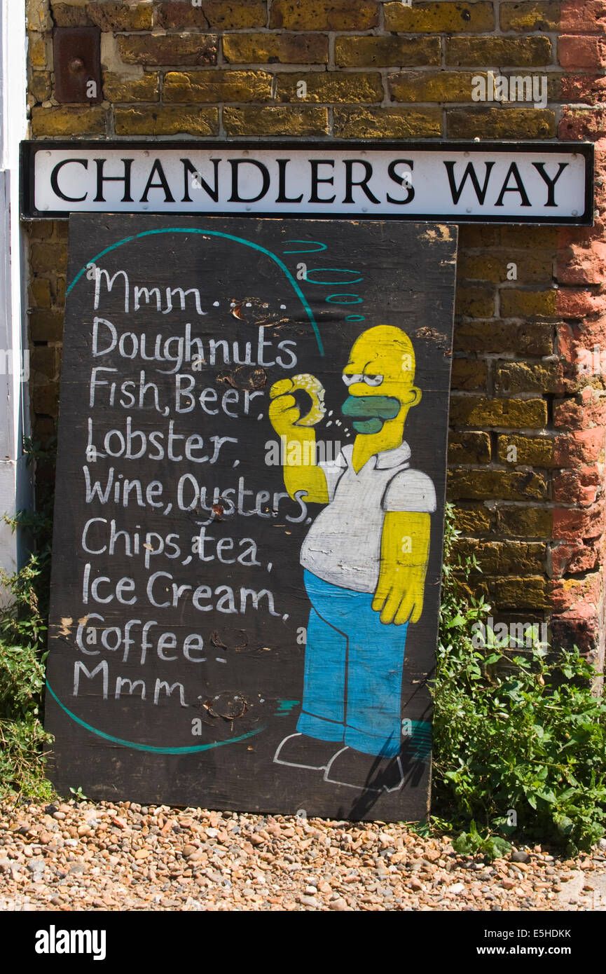 Street sign for CHANDLERS WAY with Homer Simpson cafe chalkboard at Whitstable Kent England UK Stock Photo