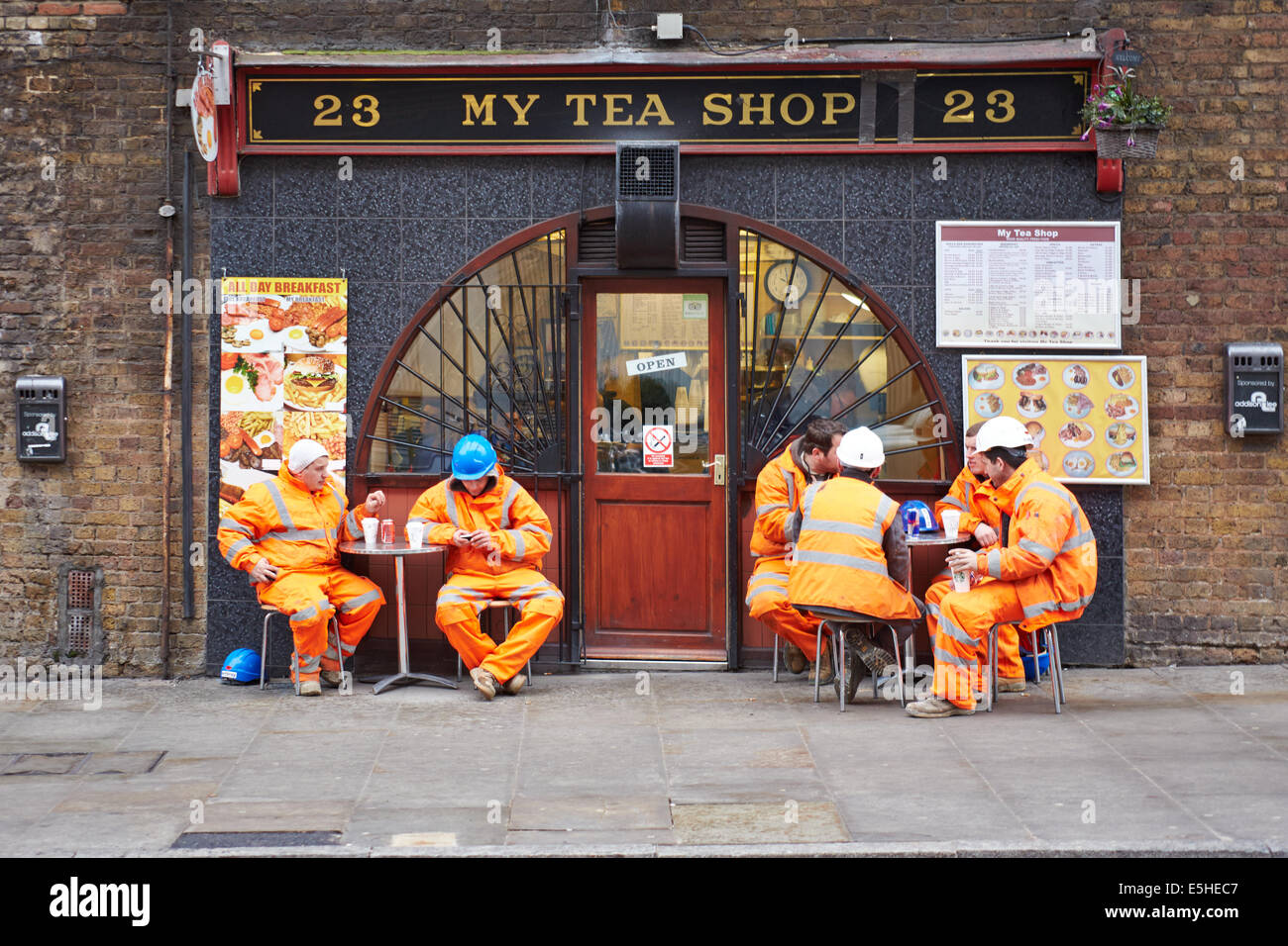 Workmen taking a break outside The Tea Shop in London Stock Photo Alamy
