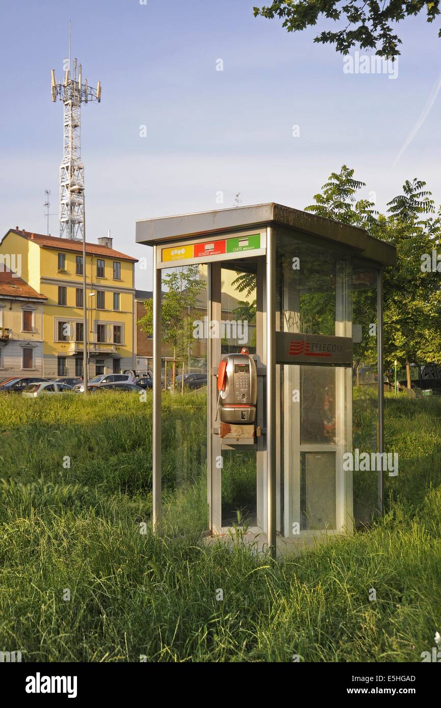 Milan, Italy, disused phone booth and cellular phone antenna Stock Photo