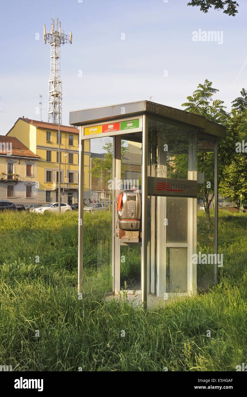 Milan, Italy, disused phone booth and cellular phone antenna Stock Photo