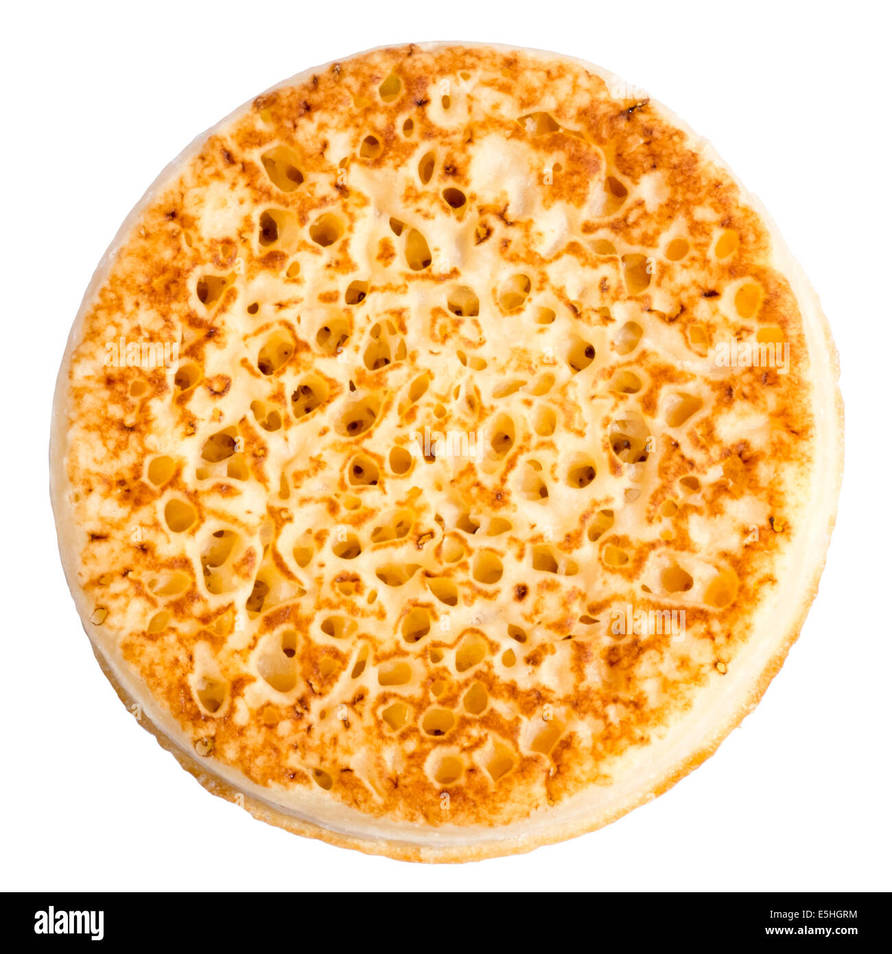 Toasted crumpet cut out or isolated on a white background. Stock Photo