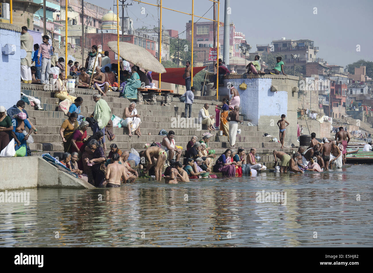 Pilgrims taking a holy bath in the river Ganga, Varanasi, Benares, Uttar Pradesh, India Stock Photo