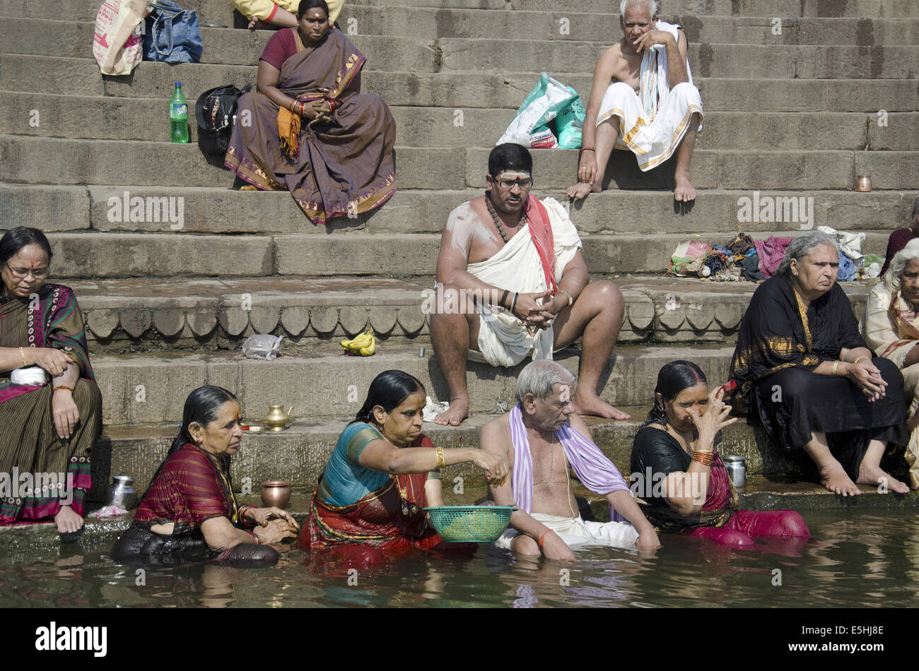 Pilgrims taking a holy bath in the river Ganga, Varanasi, Benares ...