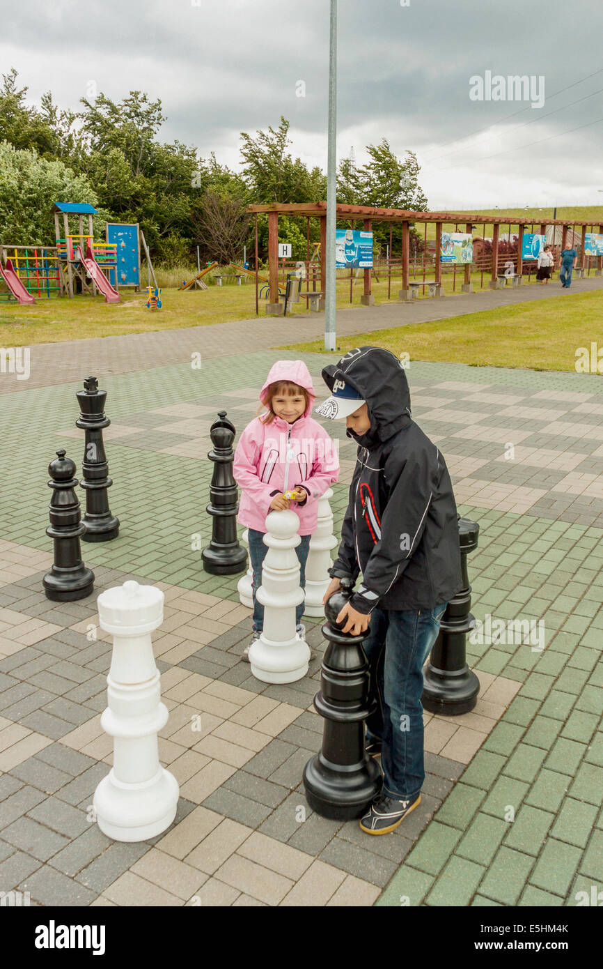 Turkey, Belek - May 20, 2019. Papilon Zeugma Hotel. Playing Outdoor Chess  Large Chess Pieces. Mother and Daughter Stock Video - Video of baby, dress:  160137023