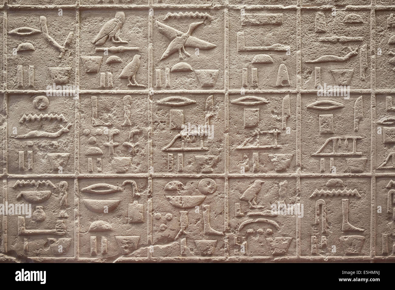 Egyptian hieroglyphics writing on stone background Stock Photo