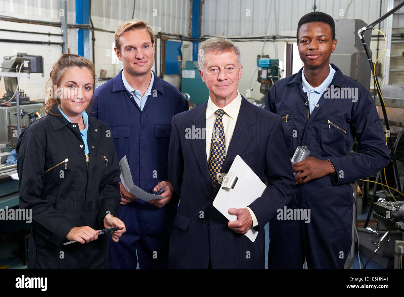 Portrait Of Manager And Staff In Engineering Factory Stock Photo