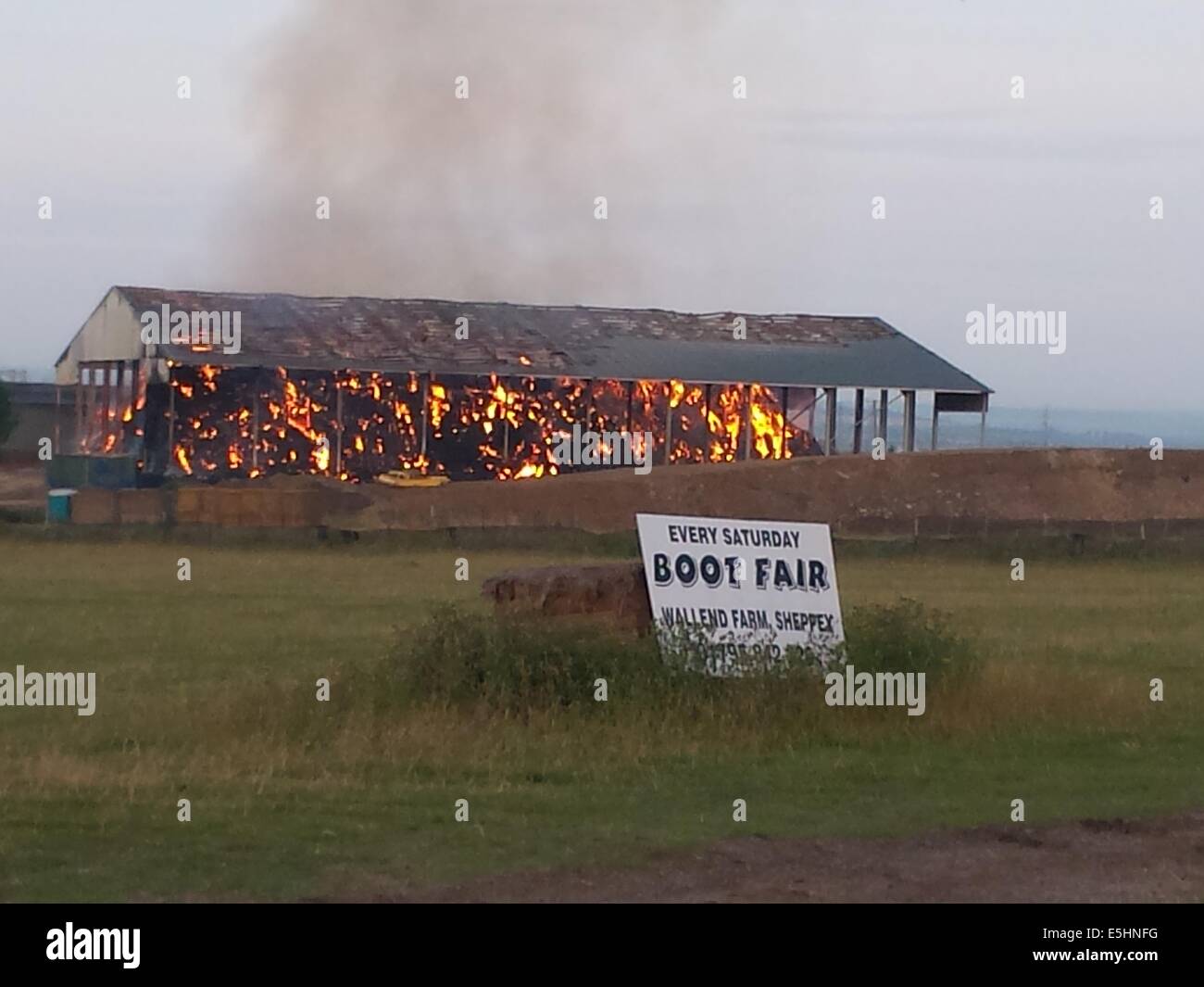 Isle of Sheppey, Kent, UK. 1st Aug, 2014. Huge fire breaks out at the newly built hay barn storage unit. Credit:  Paul Hamilton/Alamy Live News Stock Photo