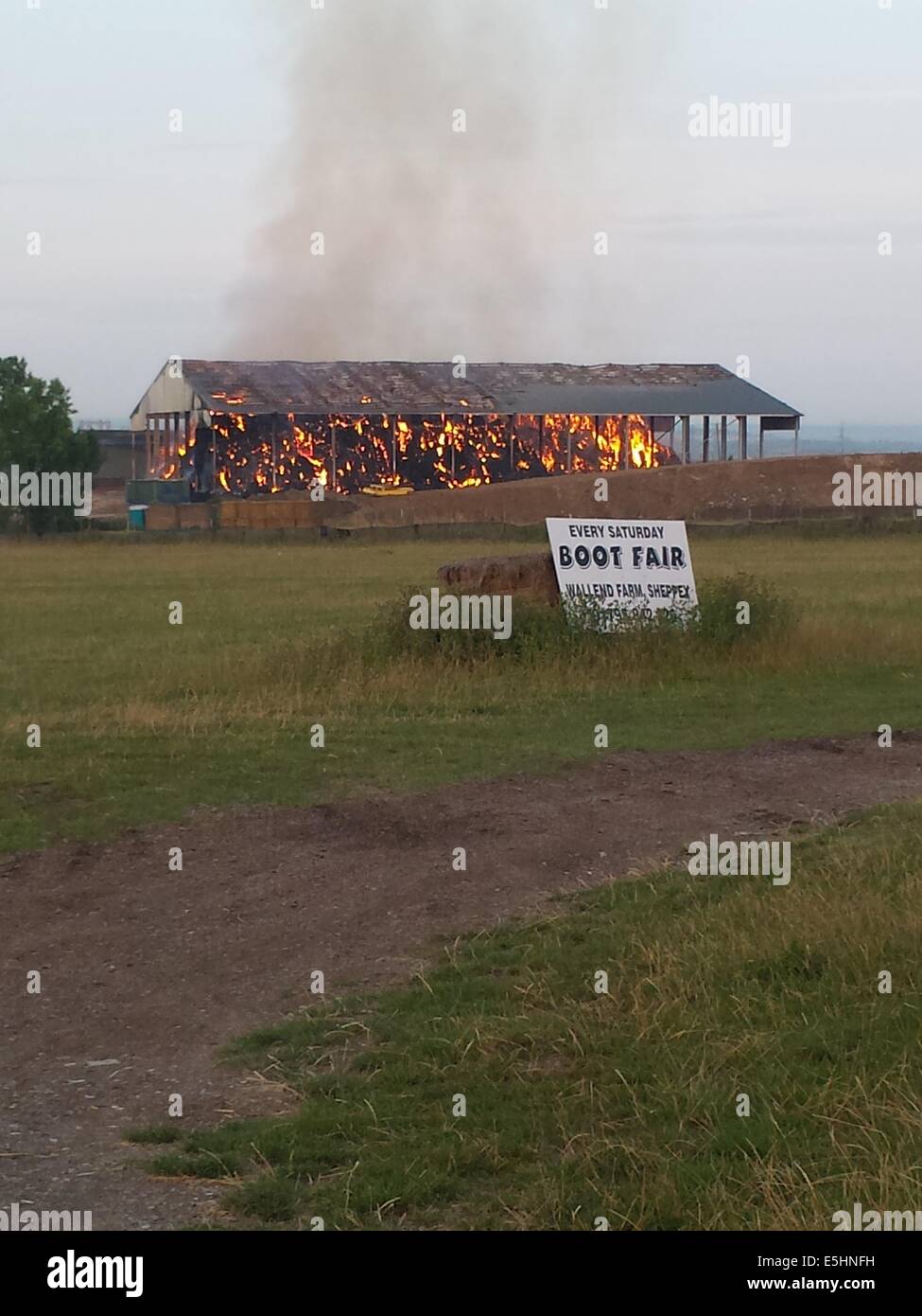 Isle of Sheppey, Kent, UK. 1st Aug, 2014. Huge fire breaks out at the newly built hay barn storage unit. Credit:  Paul Hamilton/Alamy Live News Stock Photo
