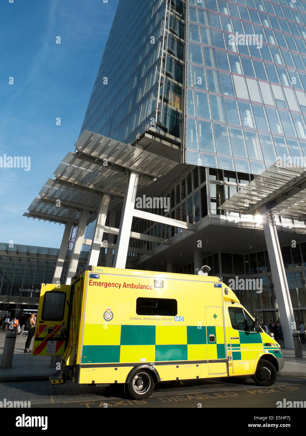 An NHS London ambulance parked outside the Shard building at London Bridge Station, England UK KATHY DEWITT Stock Photo