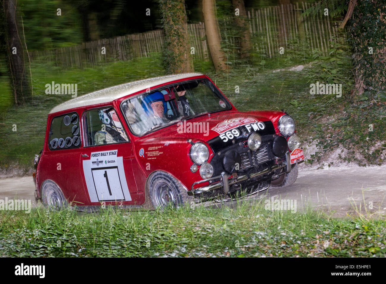 1964 Mini Cooper S, driver Rauno Aaltonen on the rally stage at the 2014 Goodwood Festival of Speed, Sussex, UK. Stock Photo