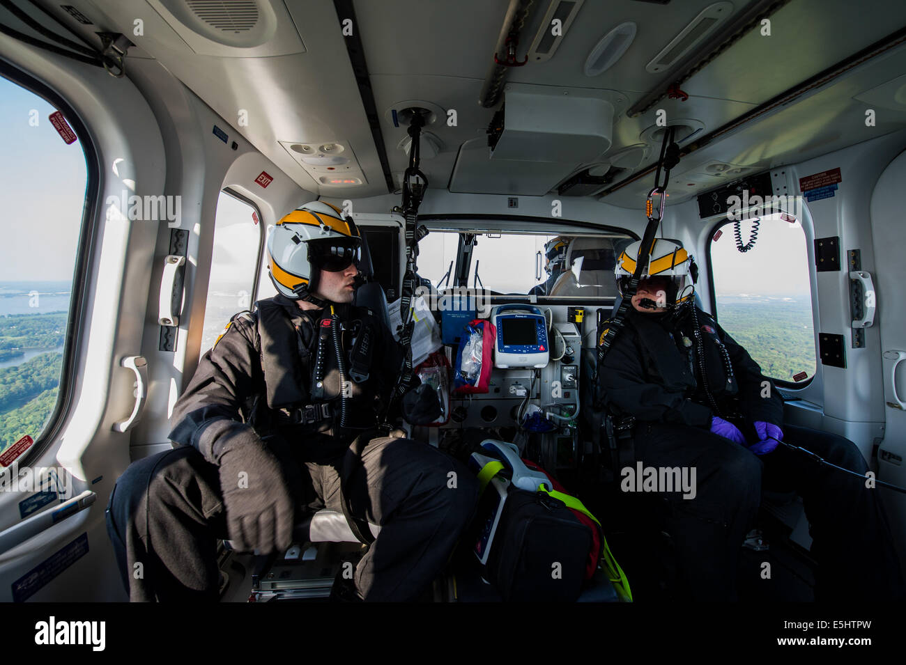 Maryland State police flight medics, Corporal Mattingly, and trooper Michael McCloskey, speak to medics on the ground and hospi Stock Photo
