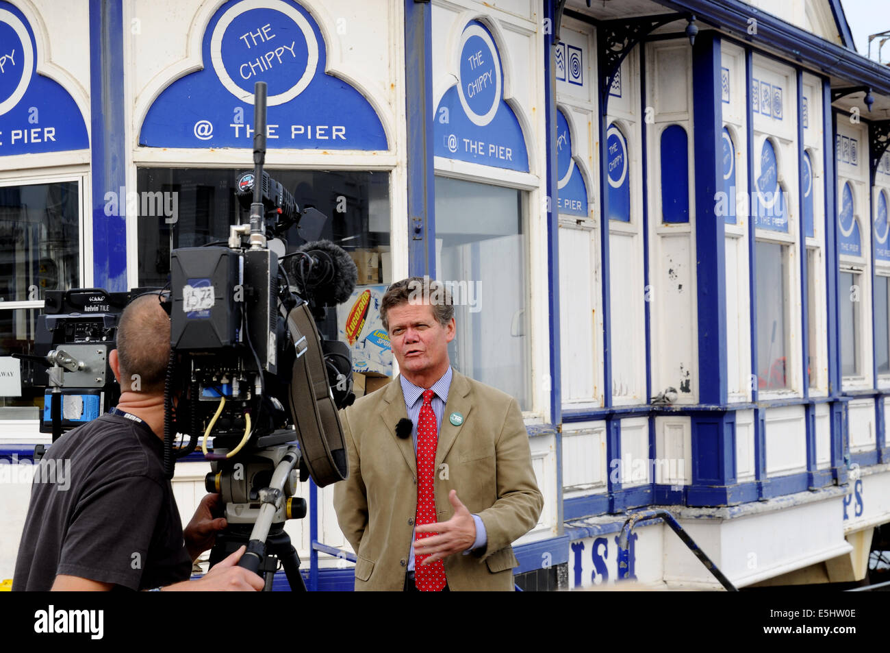 Eastbourne, East Sussex, UK. 1st Aug, 2014. Arson probe is launched by Police following Eastbourne Pier fire. Stephen Lloyd MP talks to BBC News following the announcement. Credit:  David Burr/Alamy Live News Stock Photo