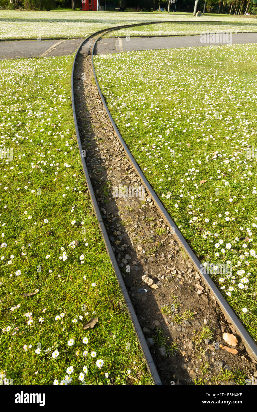 10.25 inch gauge miniature railway railroad, across grass. Poole Park