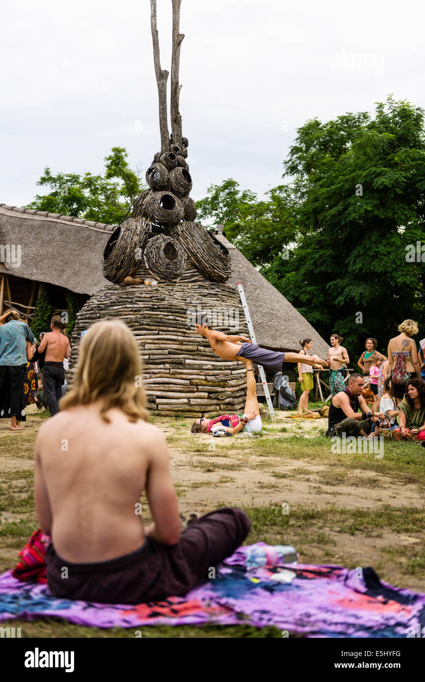 Hungary. 31st July, 2014. A couple practicing Yoga at O.Z.O.R.A. an eco-friendly music festival in Hungary. 31st of July 2014. Credit:  Tom Arne Hanslien/Alamy Live News Stock Photo