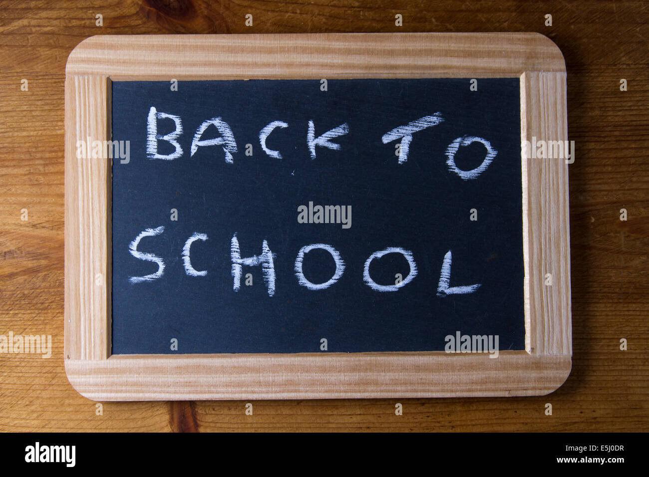 On replica writing slate used in Victorian UK schools ‘Back to School’. Stock Photo