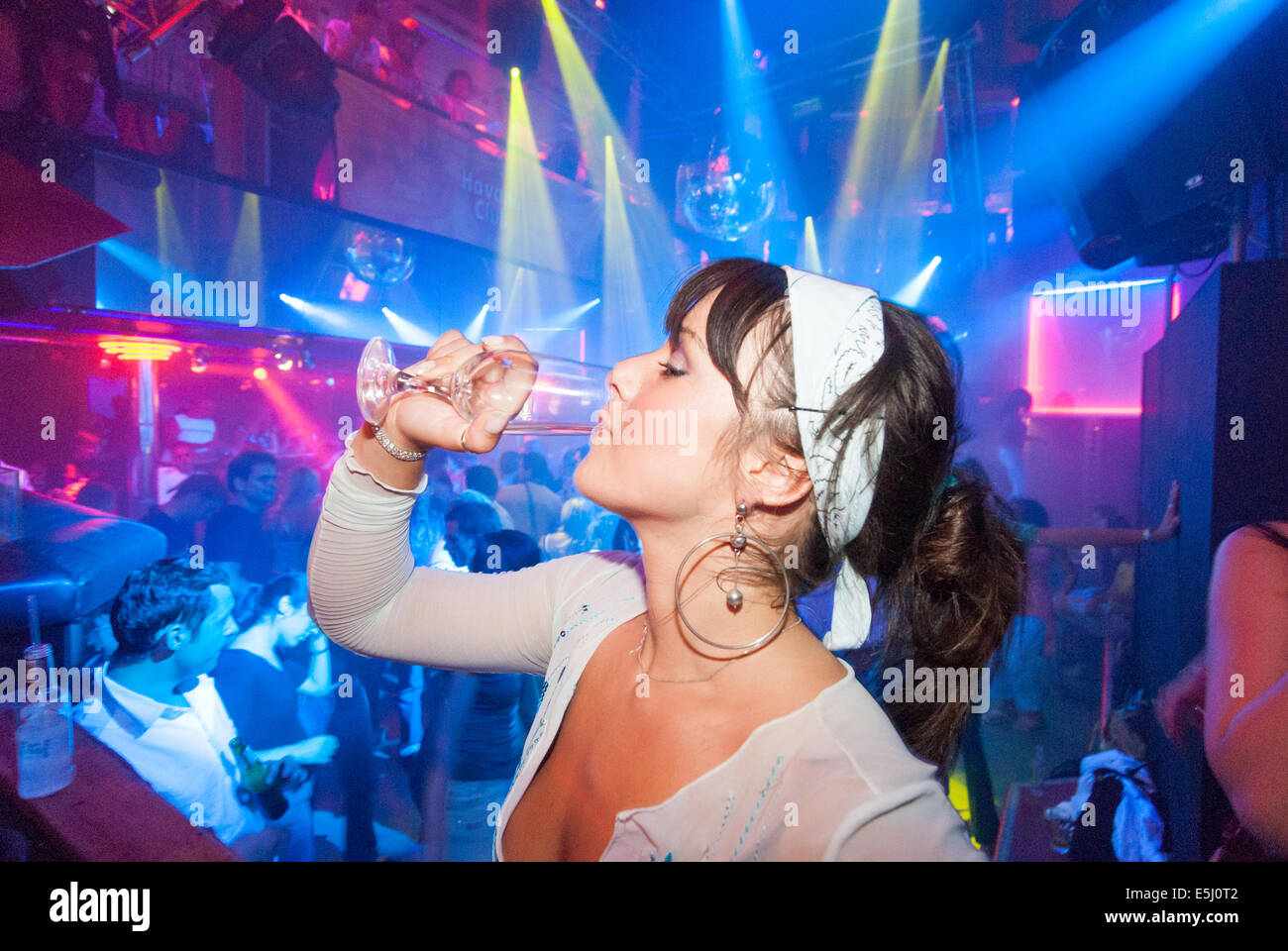 Beautiful young woman drinking at Club Essential nightclub, Riga Latvia Stock Photo