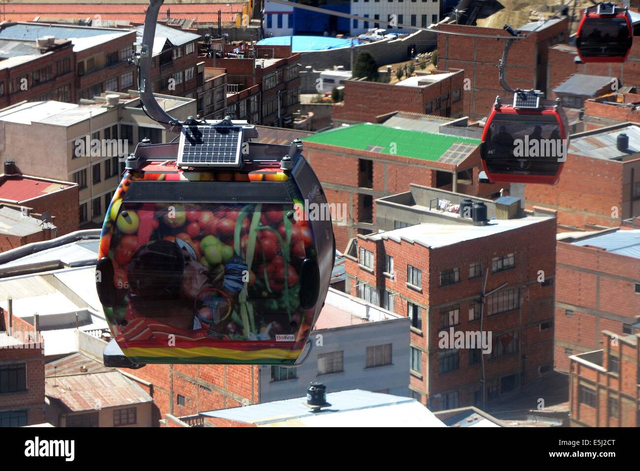 La Paz, Bolivia. 1st Aug, 2014. A cabin of the Red Line of the La Paz-El Alto Cableway is covered with a representative image of Bolivia in El Alto, La Paz department, Bolivia, on Aug. 1, 2014. Ten cableways were covered with representative images of Bolivia to celebrate Bolivia's Independence Day, which is celebrated on August 6. © Calrlos Barrios/ABI/Xinhua/Alamy Live News Stock Photo