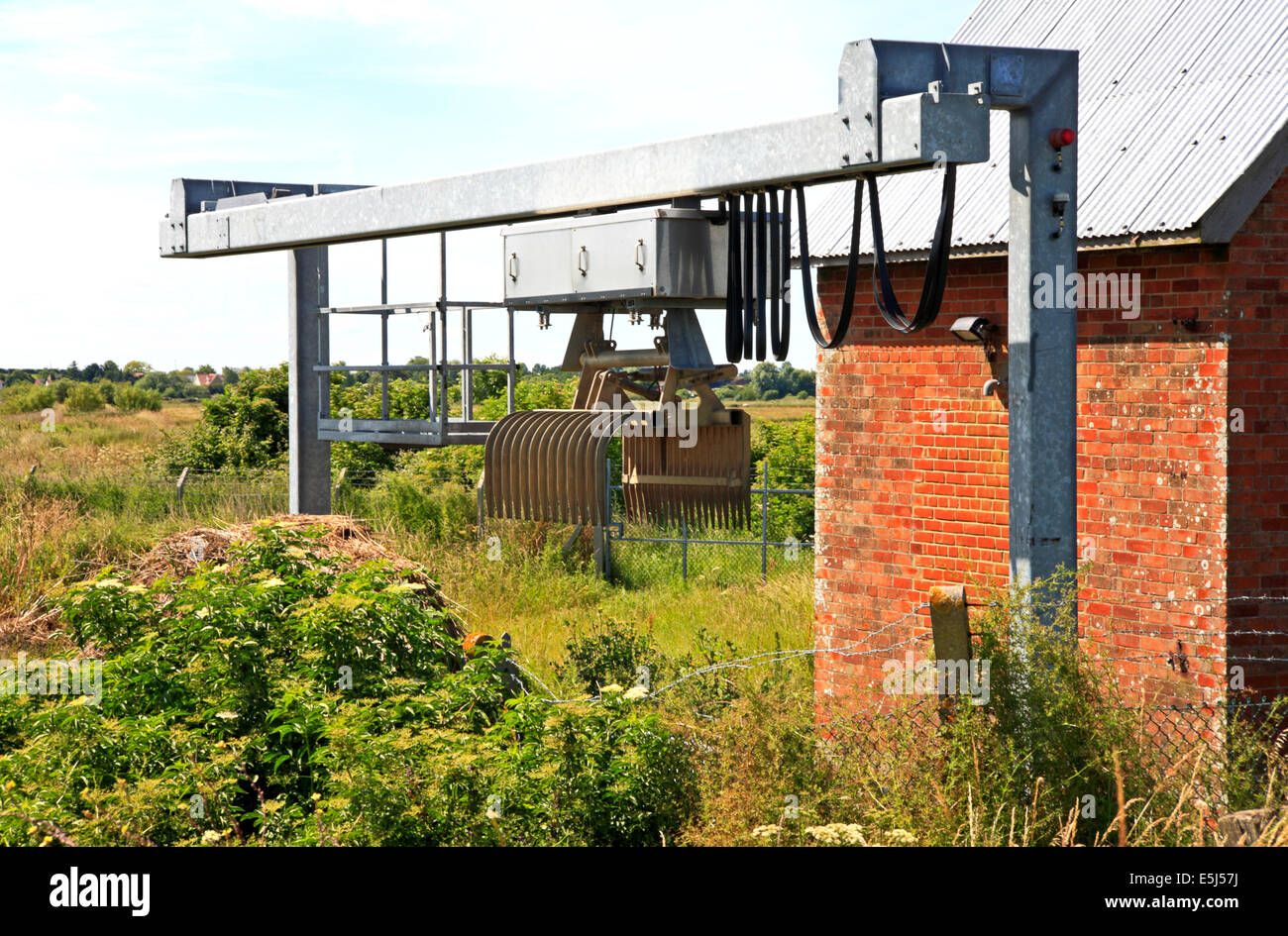 Detail of screen debris clearance grab at drainage Pump House at Burgh Castle, Norfolk, England, United Kingdom. Stock Photo