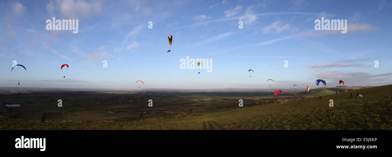 Paragliders ridge soaring at Westbury in Wiltshire Stock Photo