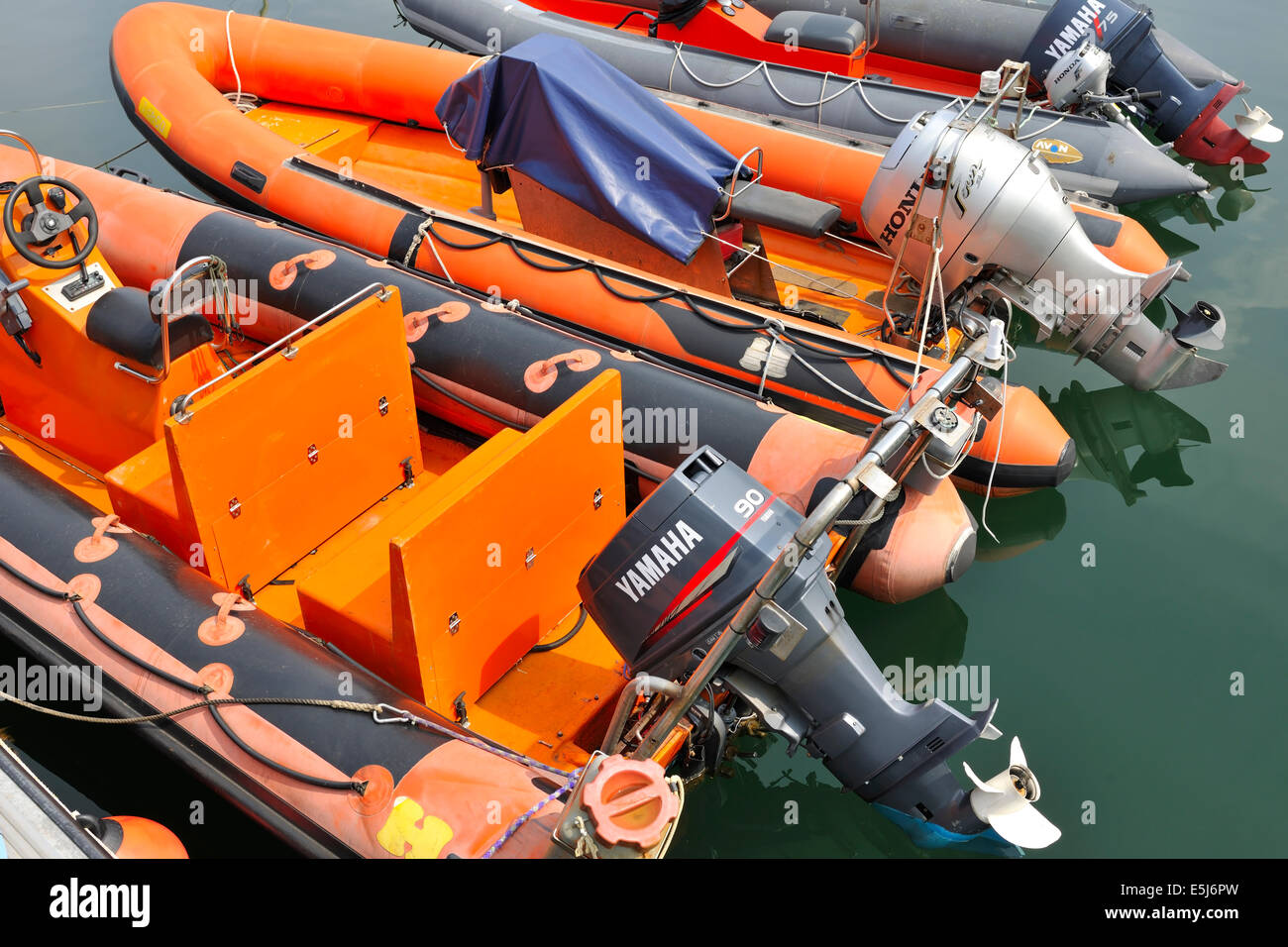 A line of Inflatable dinghies in Mallaig yachting marina, Mallaig