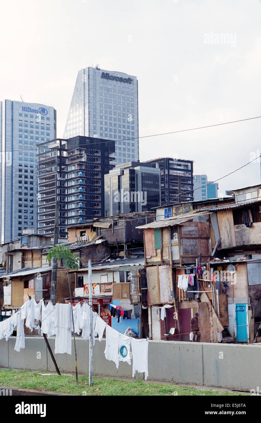 A favela slum in front of corporate towers in Sao Paulo at the turn of the new Millennium, Brazil Stock Photo