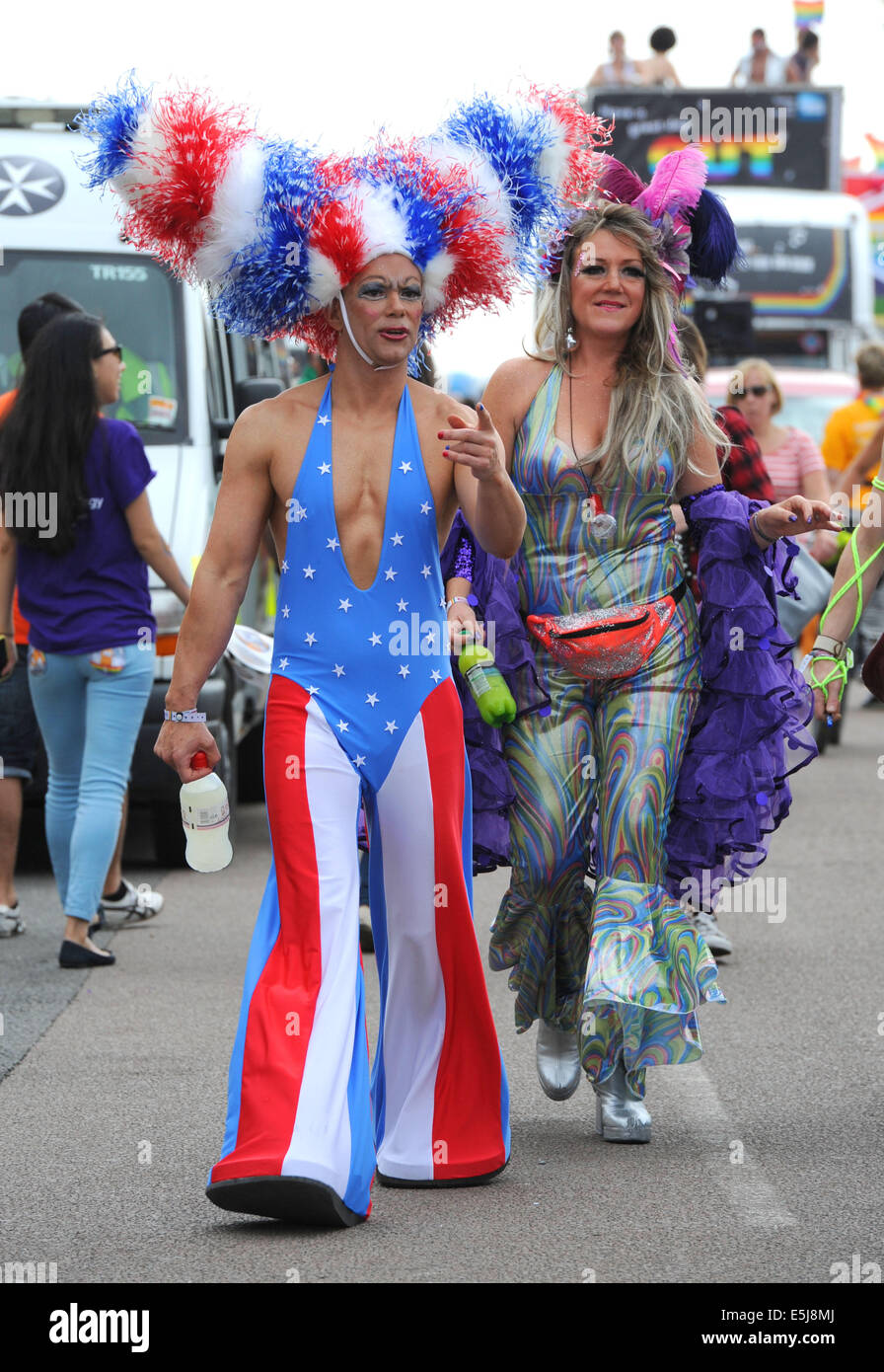 Brighton, Sussex, UK. 2nd Aug, 2014. The procession leaves leaves the seafront as thousands of people take part in the annual Brighton Pride Parade today which had a disco theme  Credit:  Simon Dack/Alamy Live News Stock Photo