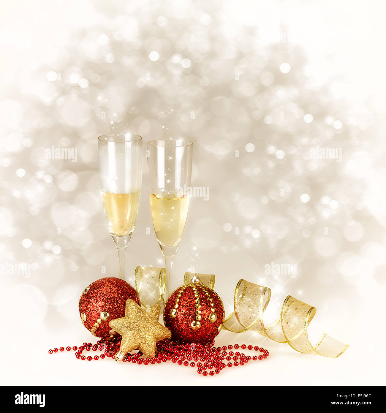 Champagne glasses with Christmas and New Year decorations in gold and ...