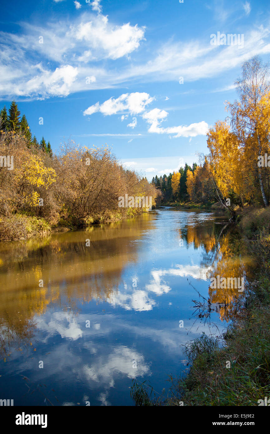 beautiful autumn landscape with the river, the forest and the blue sky Stock Photo