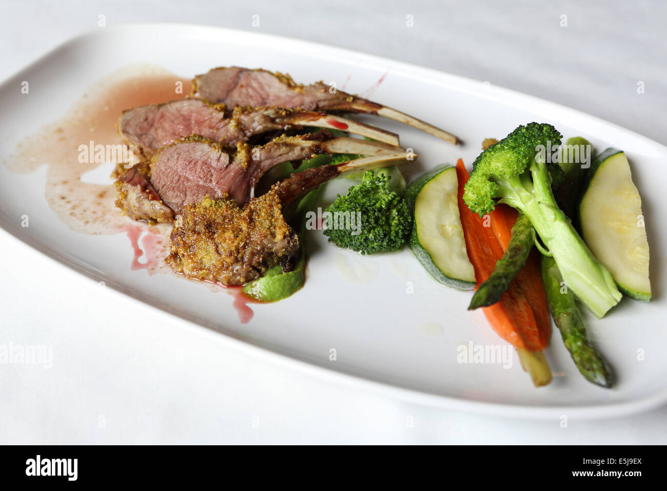 Roast lamb chops with a spicy coating and seasonal vegetables Stock