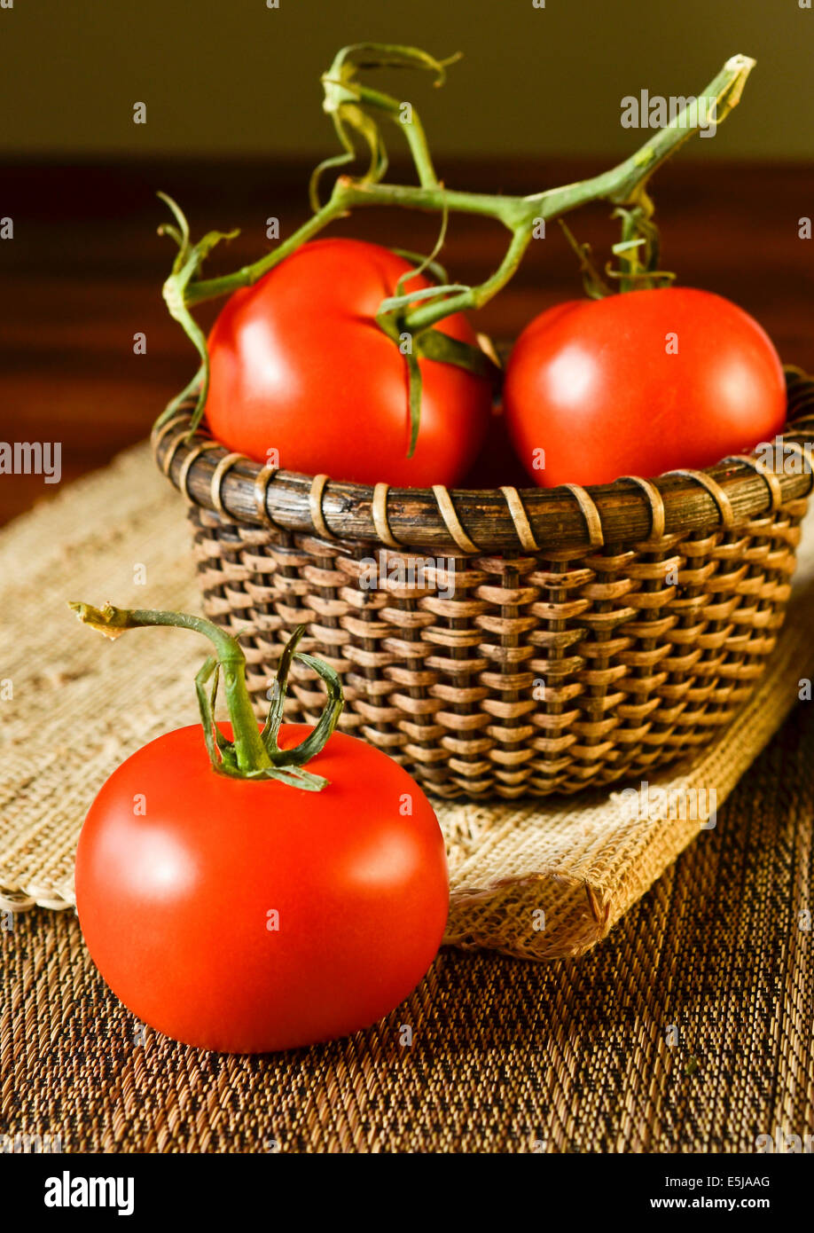 A basket of tomatoes on table hi-res stock photography and images - Alamy