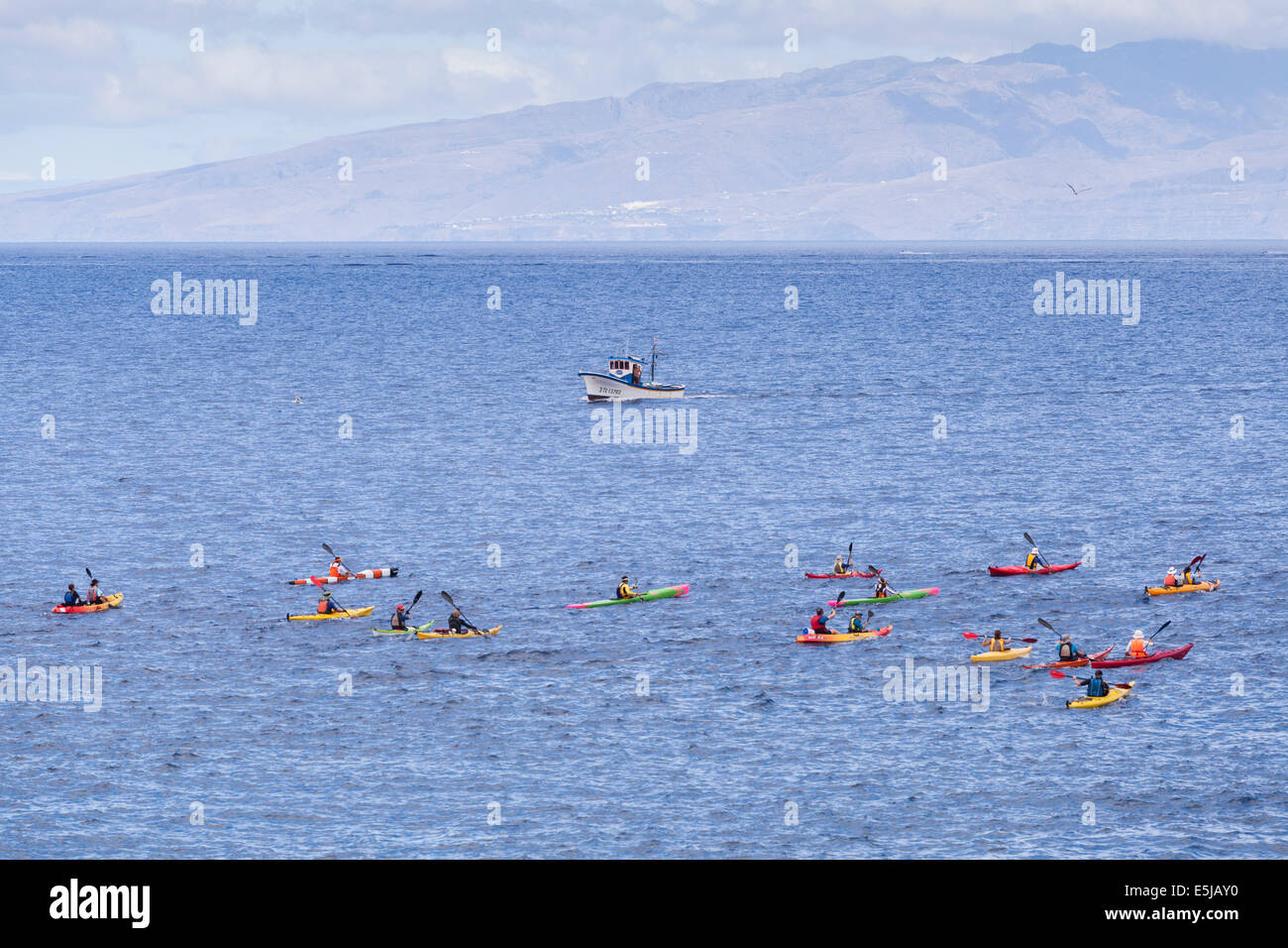 Tenerife, Canary Islands, Spain. 2nd Aug, 2014. Myriam Guillot and Jacky Boisset. World champion adventure racers take part in the 4th annual kayak race from Playa San Juan, to Los Gigantes and back. The race is an event in the programme of the village's annual fiesta in honor of San Juan Bautista and Nuestra Senora del Carmen. Tenerife, Canary Islands, Spain. Credit:  Phil Crean A/Alamy Live News Stock Photo