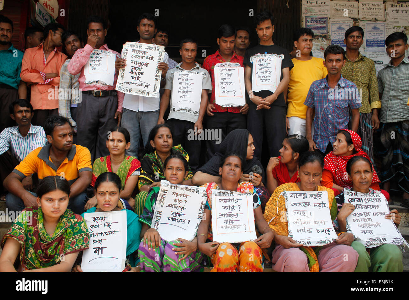 Dhaka, Bangladesh. 2nd Aug, 2014. Several hundreds of workers of Tuba Group continuing their hunger strike for the sixth consecutive day in the factory demanding outstanding salaries and Eid bonus. Over 1, 600 workers of Tuba Group, which also owns Tazreen Fashions Limited that was burnt down in November 2012 killing 112 workers, protested for their salaries and and Eid bonuses during the months of May, June and July. Credit:  zakir hossain chowdhury zakir/Alamy Live News Stock Photo