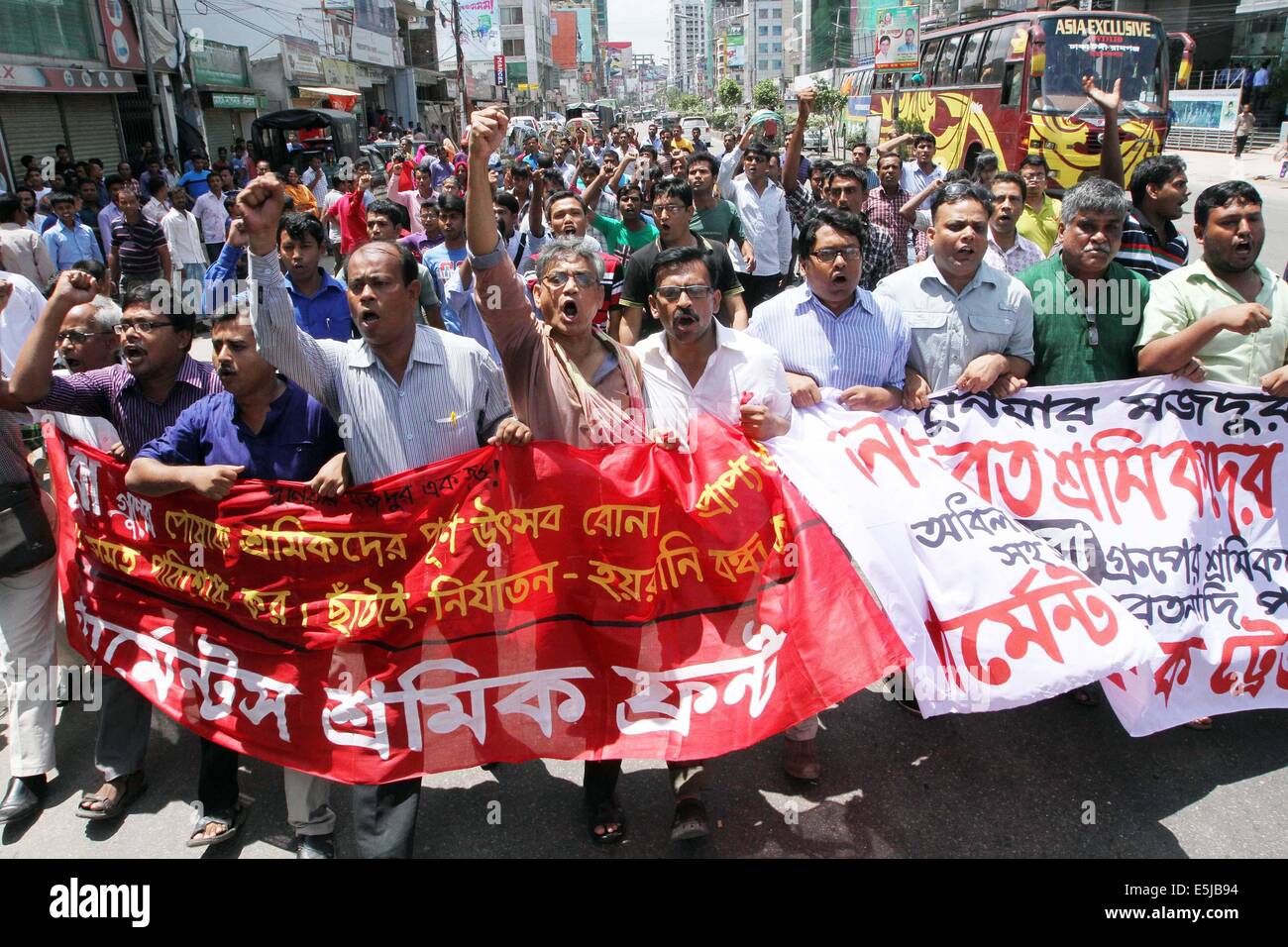 Dhaka, Bangladesh. 1st Aug, 2014. Bangladesh social activists and garment workers from the Tuba Group shout slogans during a protest against unpaid salaries, in Dhaka on August 2, 2014. Garment workers from the Tuba Group, on the sixth day of a hunger strike, are demanding three months unpaid salaries and Eid bonus. Stock Photo