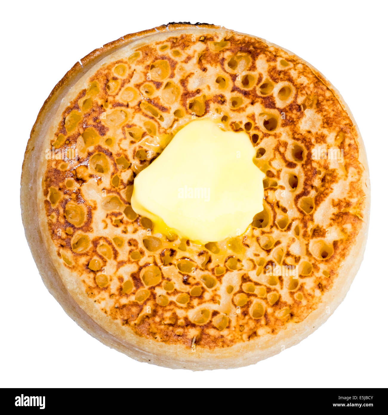 Toasted crumpet cut out or isolated against a white background. Stock Photo