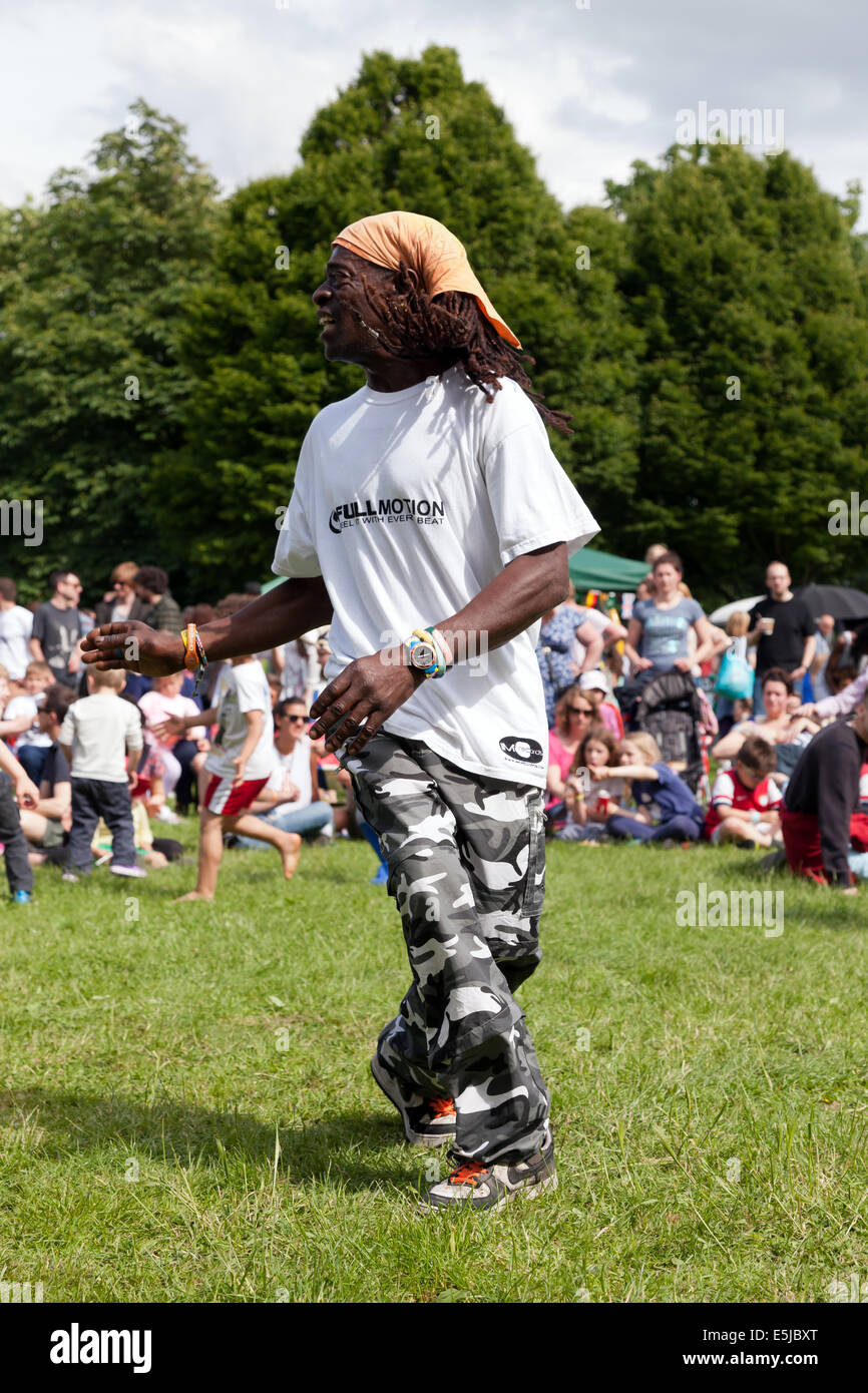 A Male dancer, from Cat Knight and the full Motion, entertaining  the crowd on Hilly Fields  as part of the , Festival Stock Photo