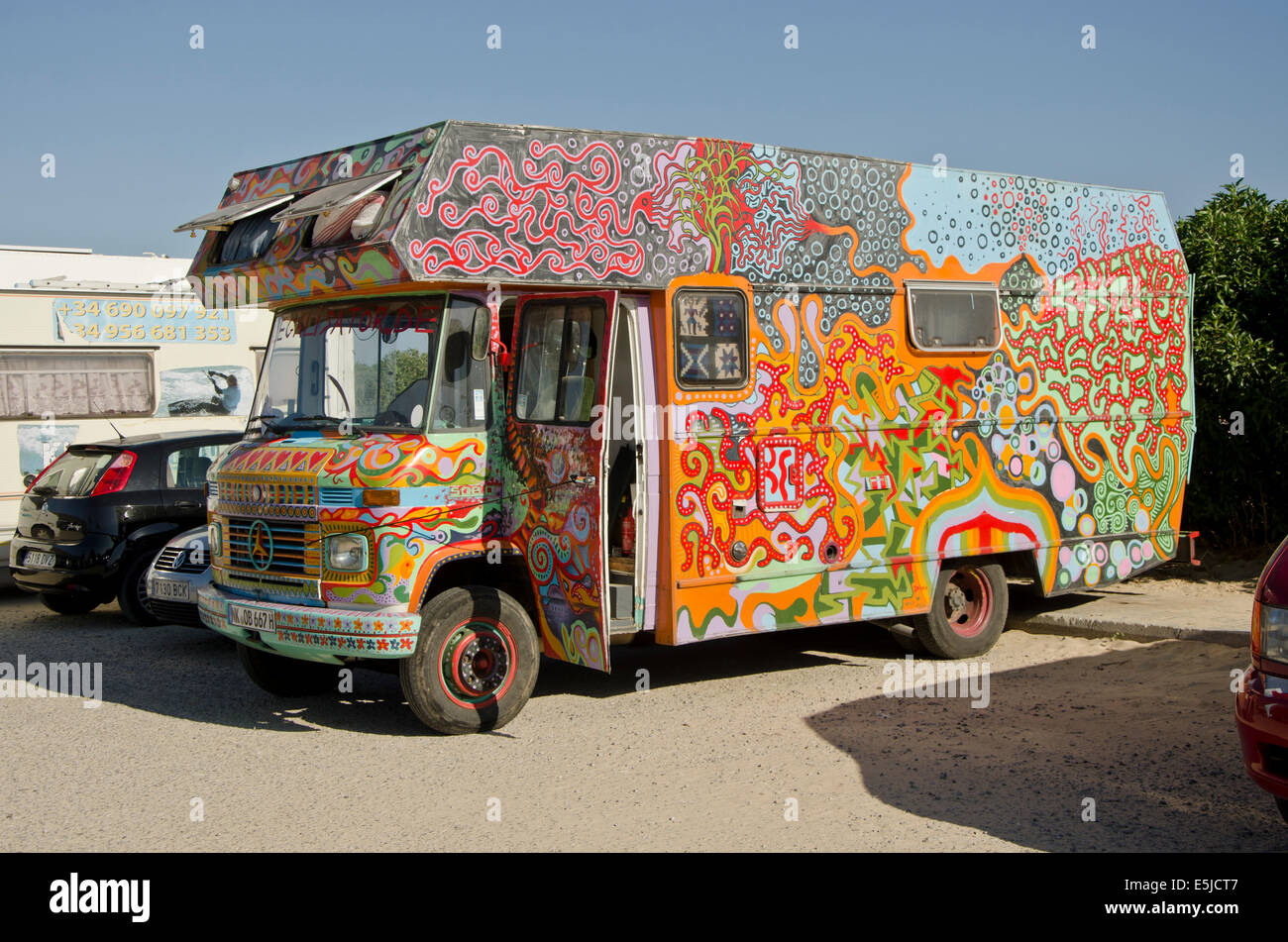 A Colourfull painted hippie truck or bus at Tarifa, Spain. Stock Photo